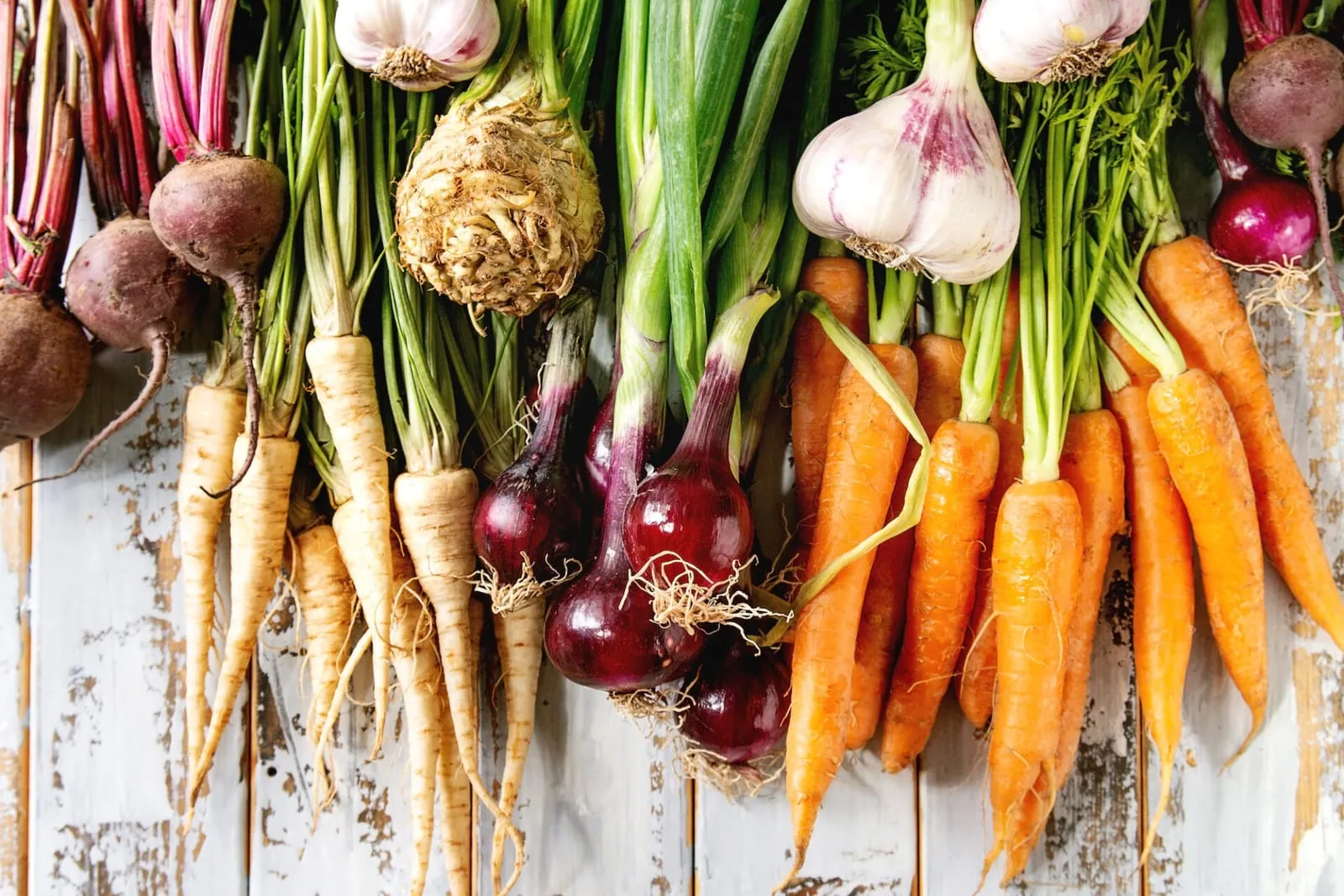 Variety of root vegetables hanging up