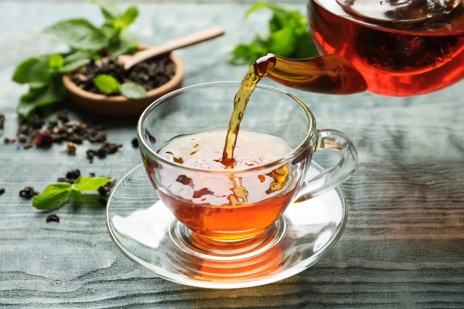 Tea being poured into teacup